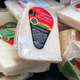 Pile of wrapped parmigiano reggiano cheese